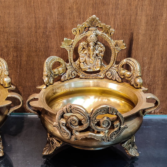 Divine Pair: Lord Ganesha and Goddess Lakshmi Brass Statues on Decorative Urli