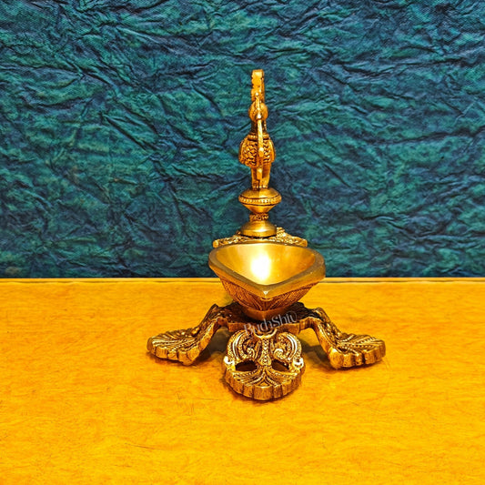 Peacock / annam design brass diya with 4 legged stand