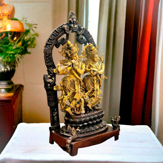 Sacred 17.5-Inch Brass Radha Krishna Idol Pair with Peacock Adorned Base