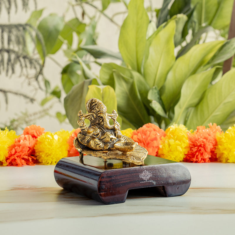 Brass Finish Ganesh Ji Sitting On Pan With Red Velvet Box
