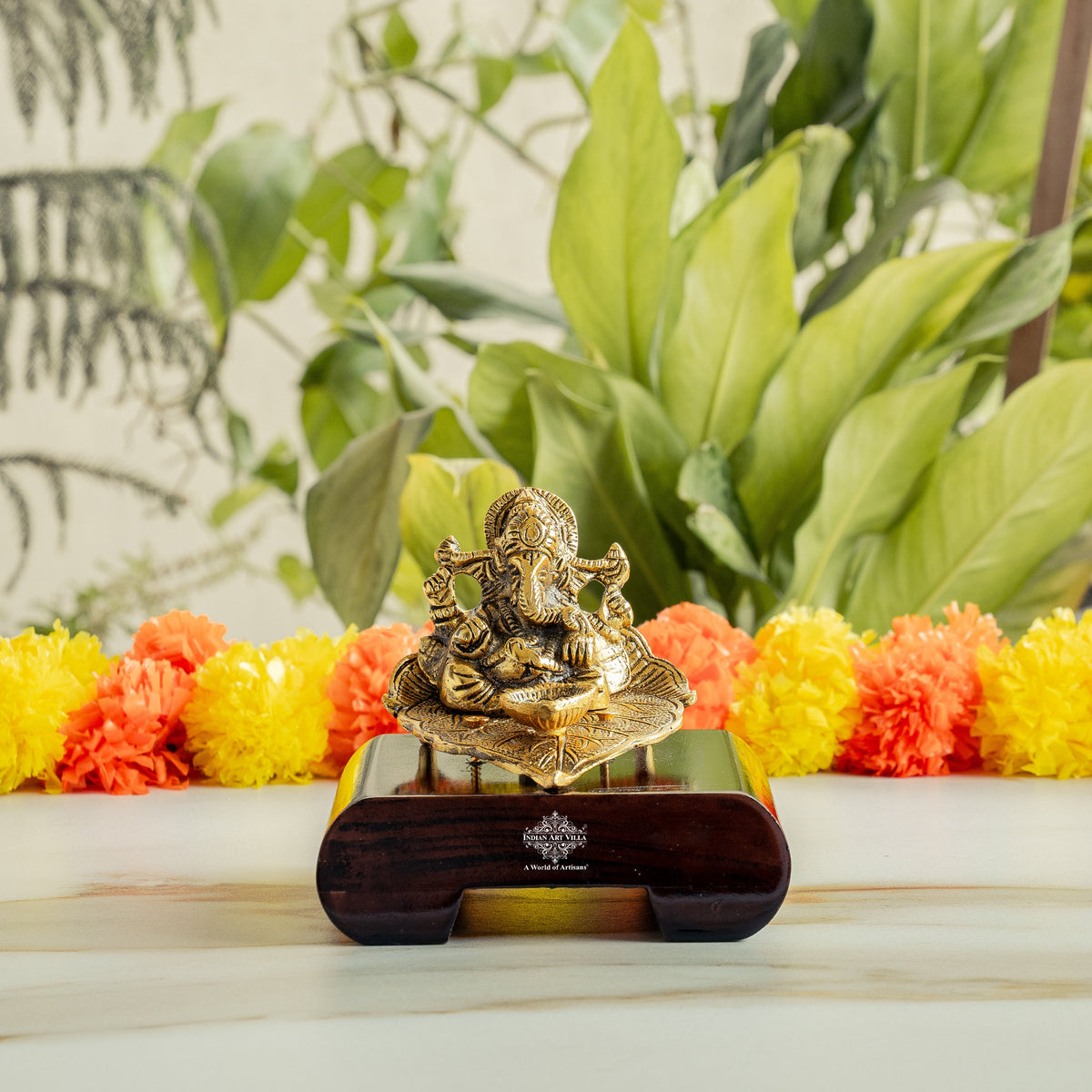 Brass Finish Ganesh Ji Sitting On Pan With Red Velvet Box