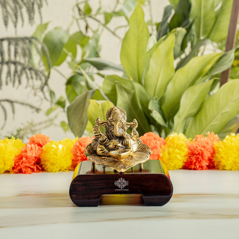 Brass Finish Ganesh Ji Sitting On Pan With Red Velvet Box