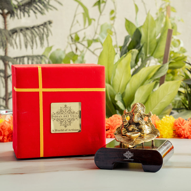 Brass Finish Ganesh Ji Sitting On Pan With Red Velvet Box