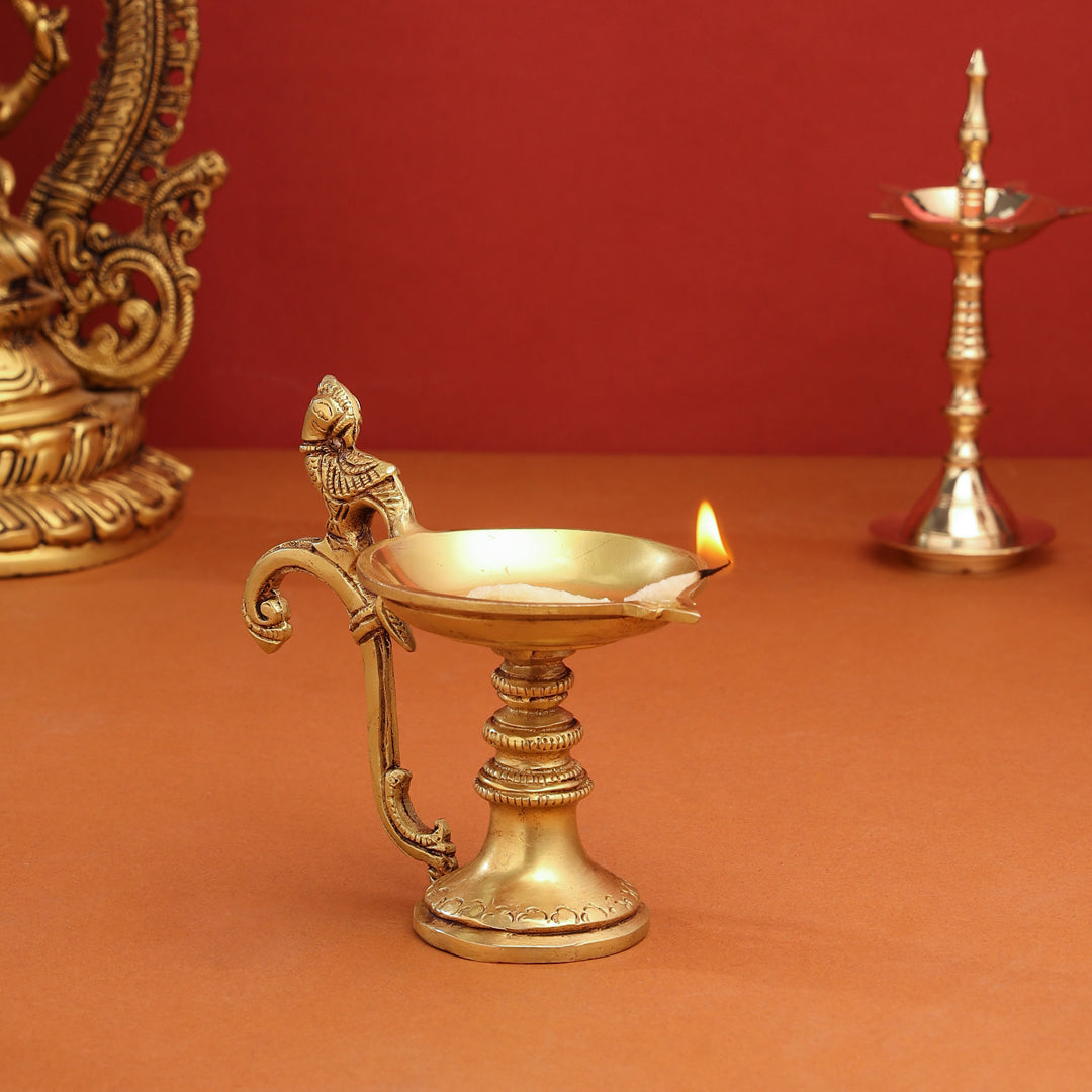 Brass Ethnic Peacock Diya With Handle (5 Inch)
