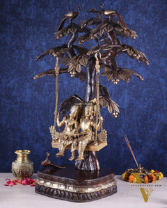 3-Foot Brass Radha Krishna Swing with Kalpavriksha and Peacock Motifs in Brown-Gold Finish