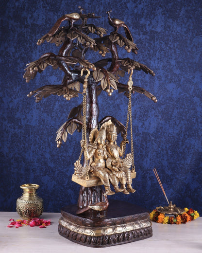 3-Foot Brass Radha Krishna Swing with Kalpavriksha and Peacock Motifs in Brown-Gold Finish