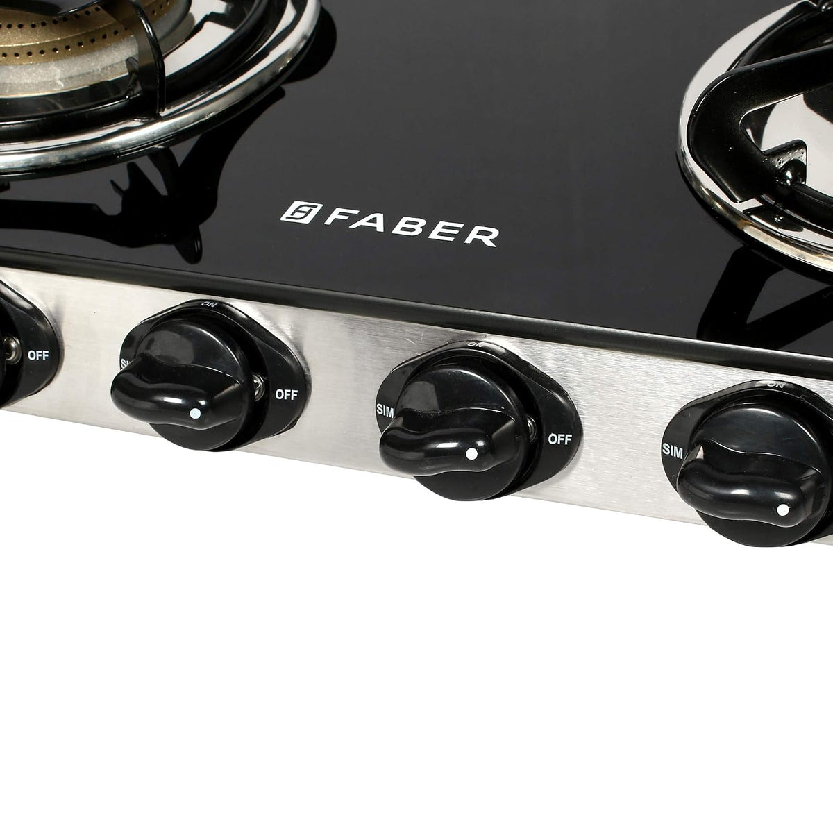 Faber Jumbo 4 Brass Burner Cooktop | 1 Jumbo, 2 Medium, 1 Small | Drip Tray | Toughened Glass | SS Finish | Ergonomic Kn