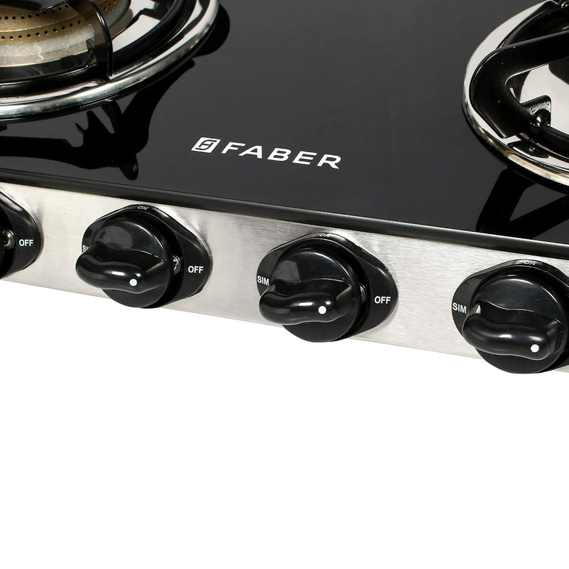Faber Jumbo 4 Brass Burner Cooktop | 1 Jumbo, 2 Medium, 1 Small | Drip Tray | Toughened Glass | SS Finish | Ergonomic Kn