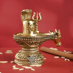 Brass Shivling with Nandi Face & Trishul – Decorative Spiritual Idol
