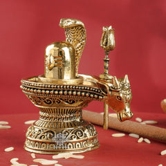 Brass Shivling with Nandi Face & Trishul – Decorative Spiritual Idol