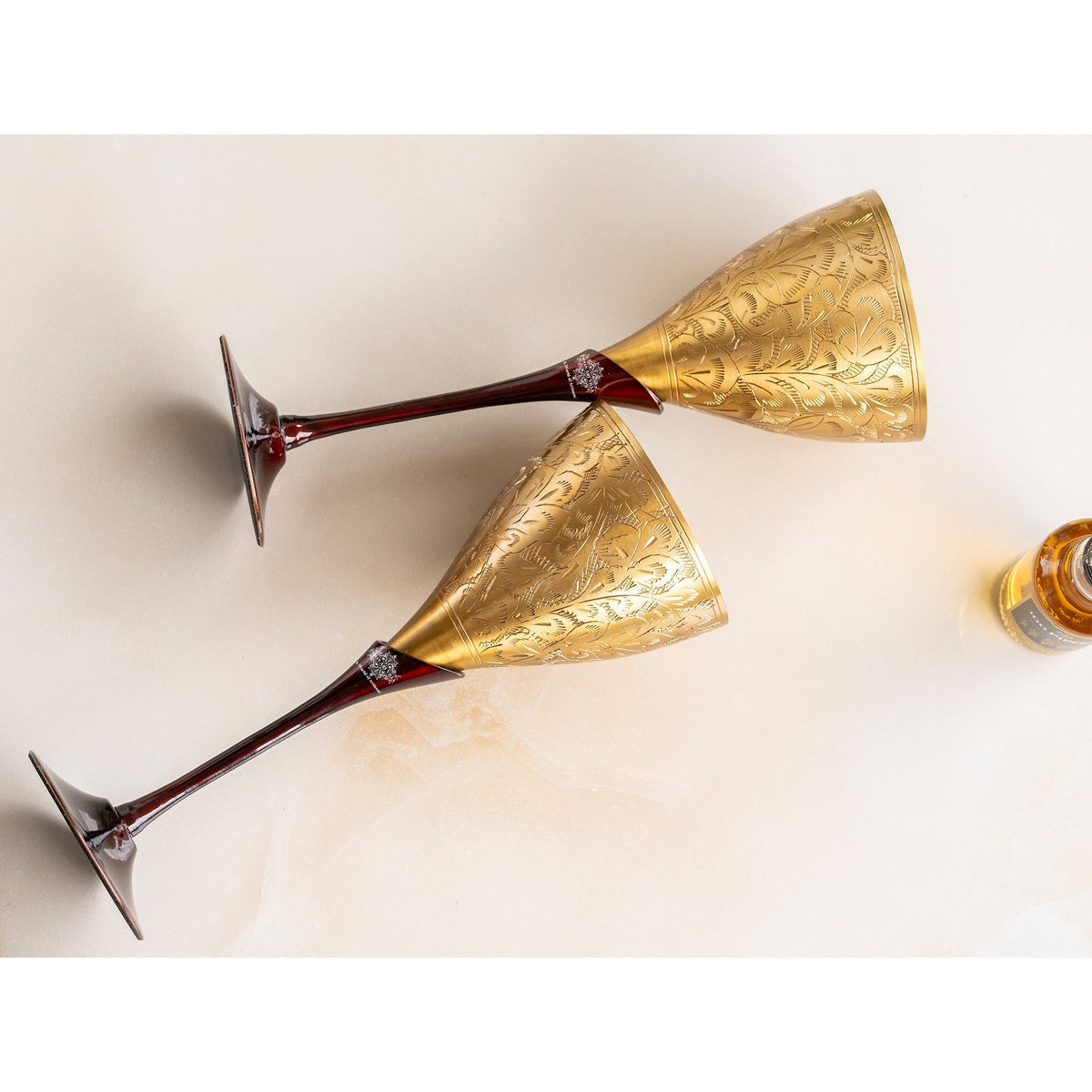 Brass champagne Embossed Glass With Black Bottom Stand - 200 ML