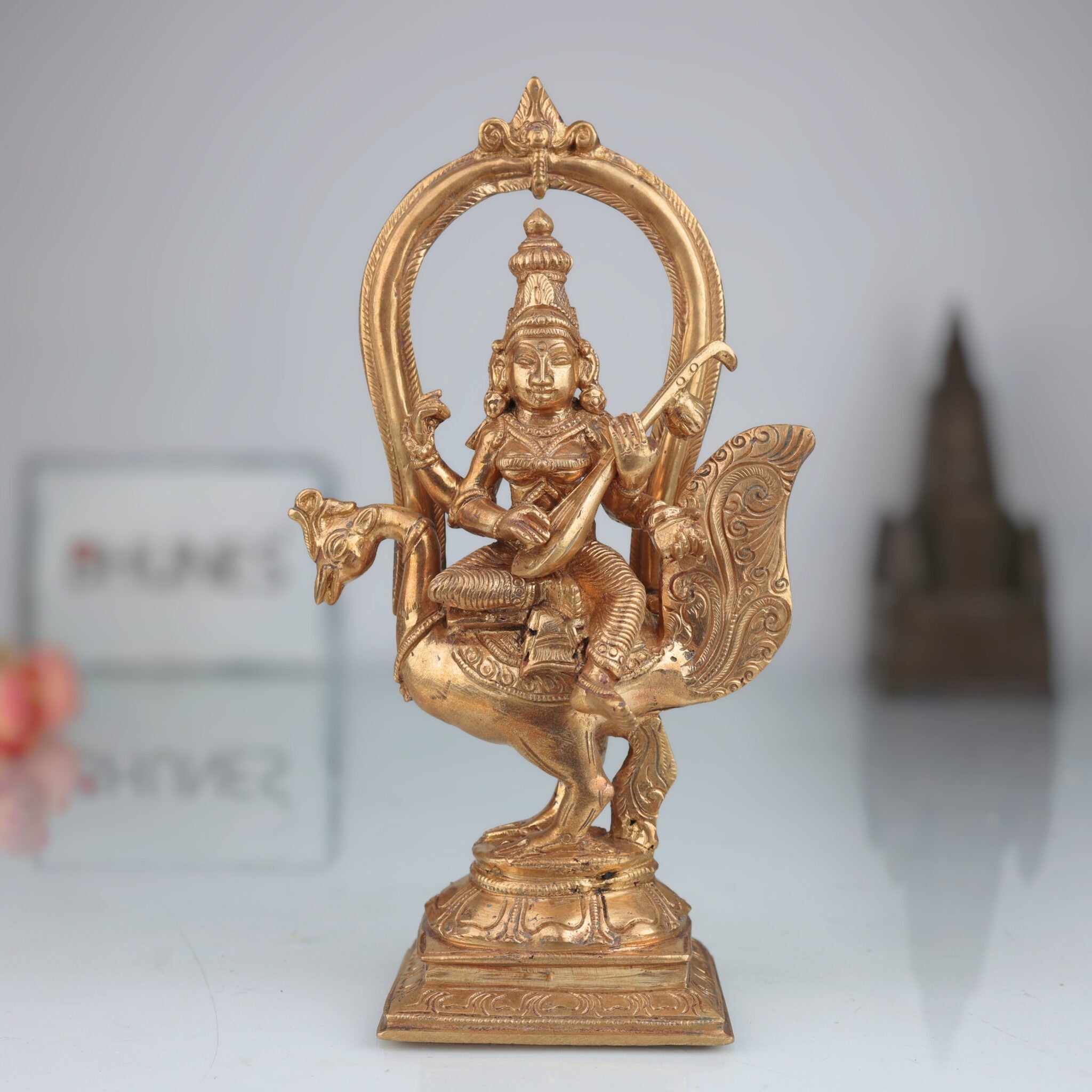 Elegant Handmade Bronze Panchaloha Saraswati Idol Sitting on Peacock with Veena, Goddess of Knowledge, Wisdom & Art Sculpture for Temple, Home & Office Decor,Gold, 8.5 Inch, 1 Piece