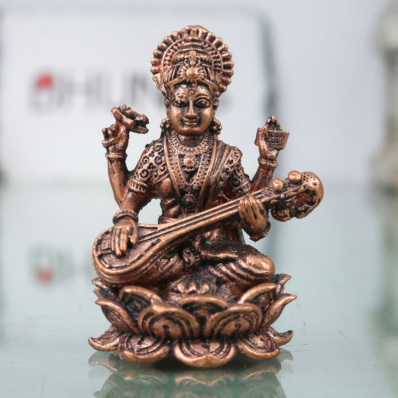 Copper Saraswati Murti Sharada Vagdevi Veenavadini Vidya Devi Idol for Pooja Mandir Home Decor, Brown, 2 Inch, 1 Piece