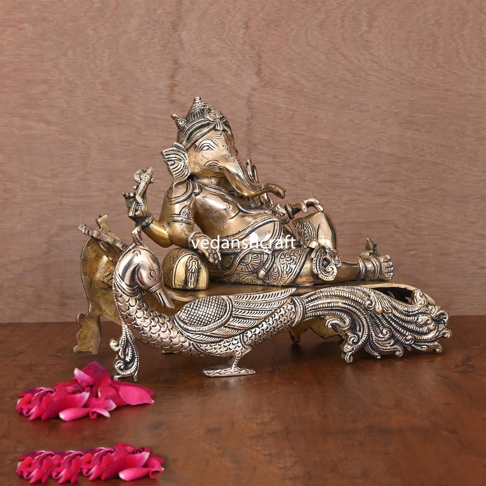 Brass Ganesha Resting On Peacock Couch (7.7 Inch)