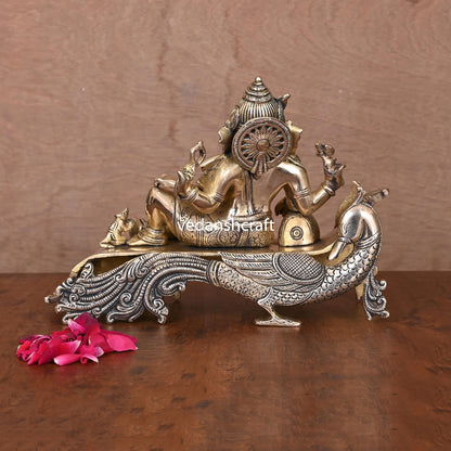 Brass Ganesha Resting On Peacock Couch (7.7 Inch)