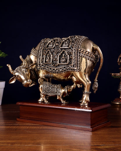 Brass Superfine Kamdhenu Cow with Calf with ashtalakshmi carvings on Wooden Base – 9.5 Inch
