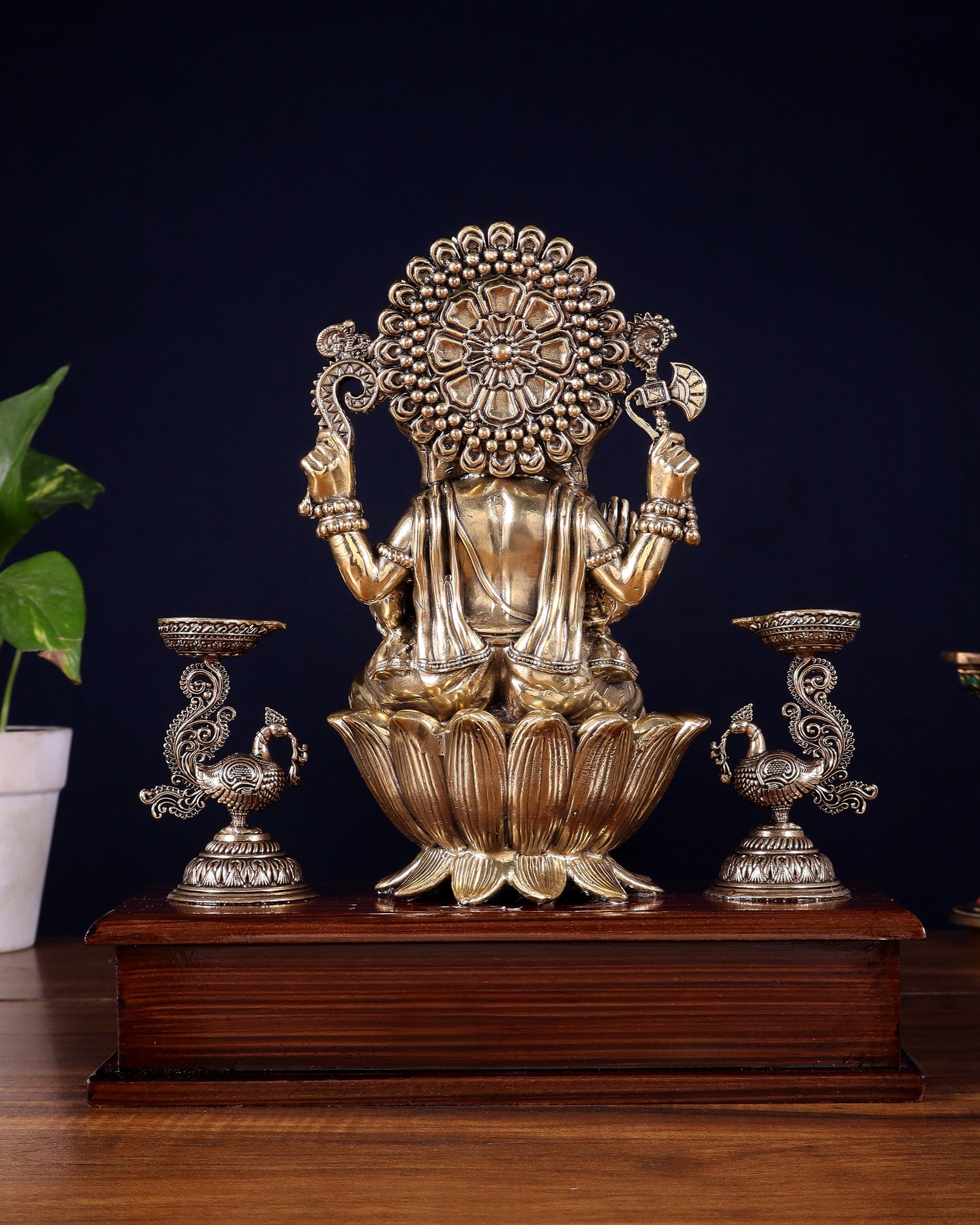 Brass Superfine Lord Ganesha Idol with Twin Peacock Lamps on Wooden Base – 9.5 Inch