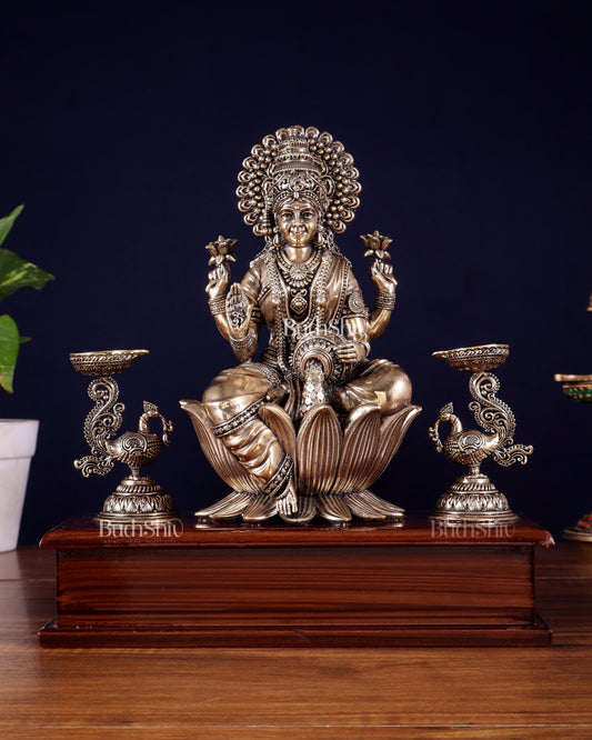 Brass Superfine Goddess Lakshmi Idol with Twin Peacock Lamps on Wooden Base – 9.5 Inch
