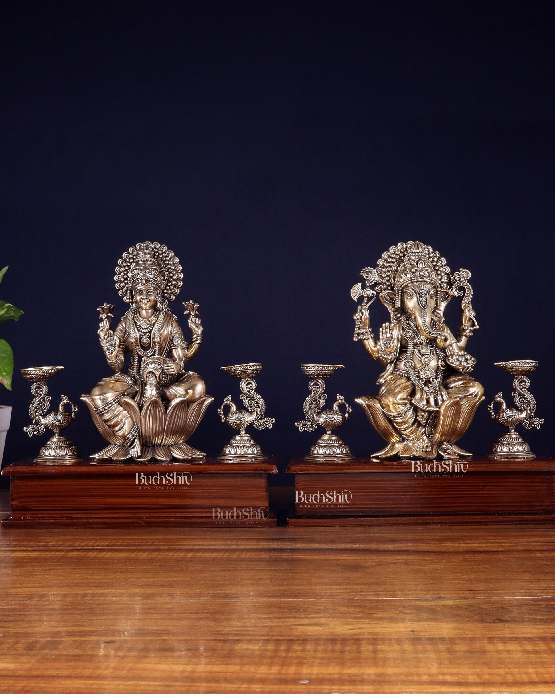 Brass Superfine Ganesh–Lakshmi Pair with Twin Peacock Lamps on Wooden Base – 9.5 Inch