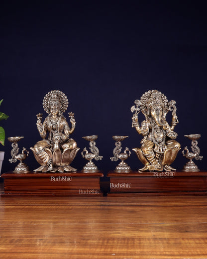 Brass Superfine Ganesh–Lakshmi Pair with Twin Peacock Lamps on Wooden Base – 9.5 Inch