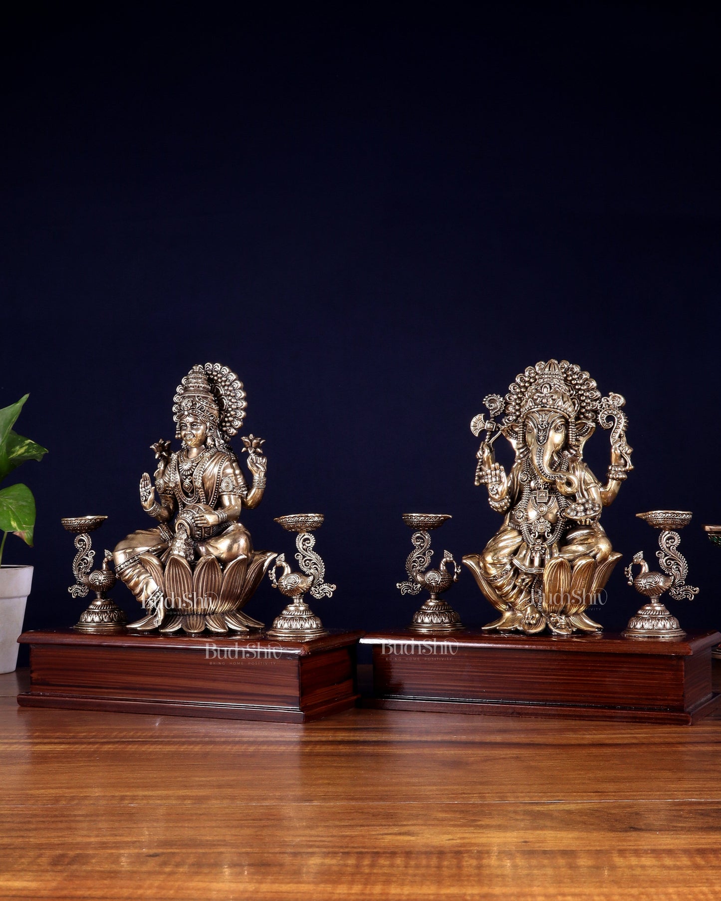 Brass Superfine Ganesh–Lakshmi Pair with Twin Peacock Lamps on Wooden Base – 9.5 Inch