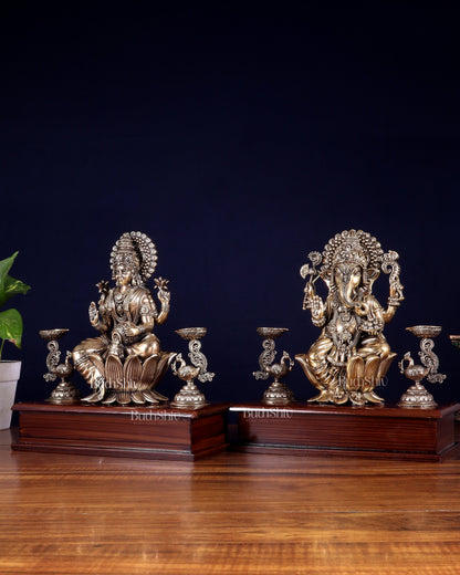 Brass Superfine Ganesh–Lakshmi Pair with Twin Peacock Lamps on Wooden Base – 9.5 Inch