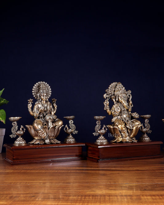 Brass Superfine Ganesh–Lakshmi Pair with Twin Peacock Lamps on Wooden Base – 9.5 Inch
