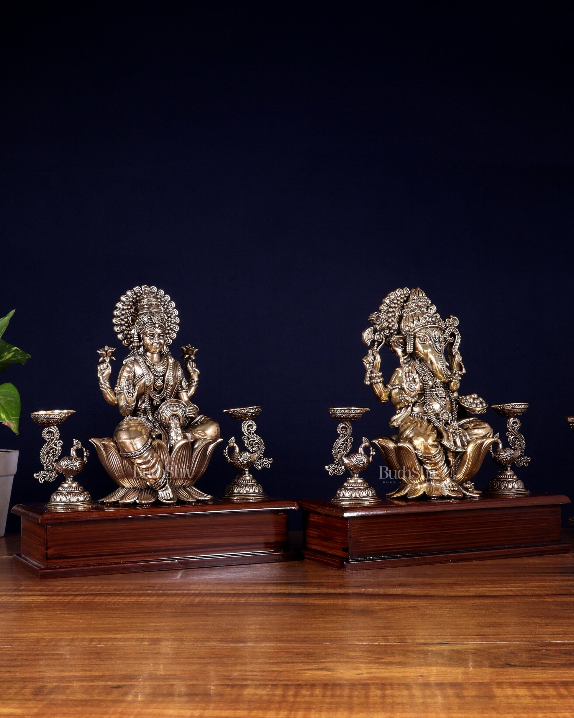 Brass Superfine Ganesh–Lakshmi Pair with Twin Peacock Lamps on Wooden Base – 9.5 Inch