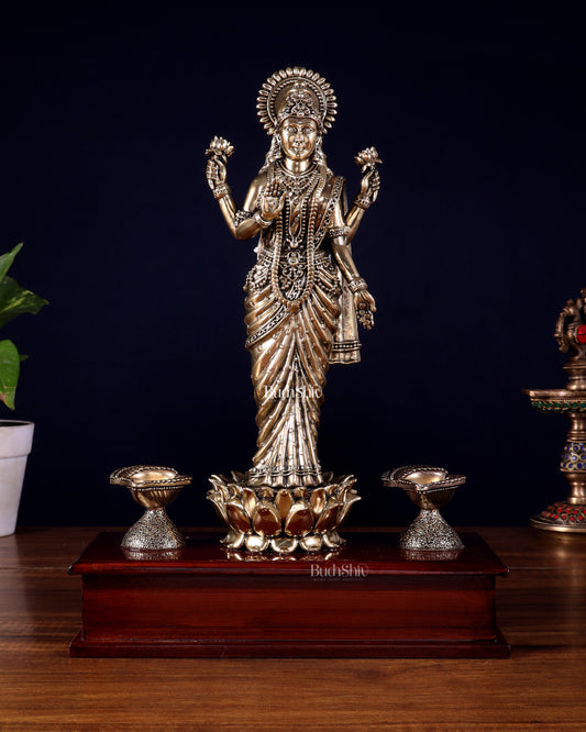 Brass Superfine Goddess Lakshmi Standing on Wooden Base with Diyas – 12.5 Inch