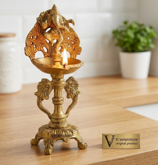 Brass engraved Dancing Ganesha diya with a stand peacock and floral design 9 inch
