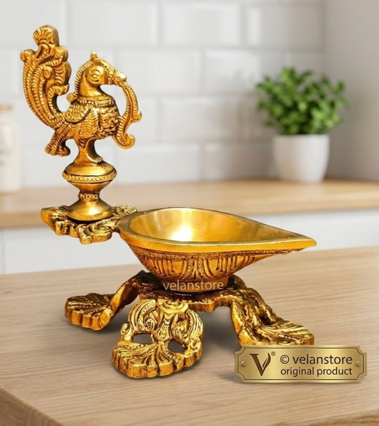 Peacock / annam design brass diya with 4 legged stand