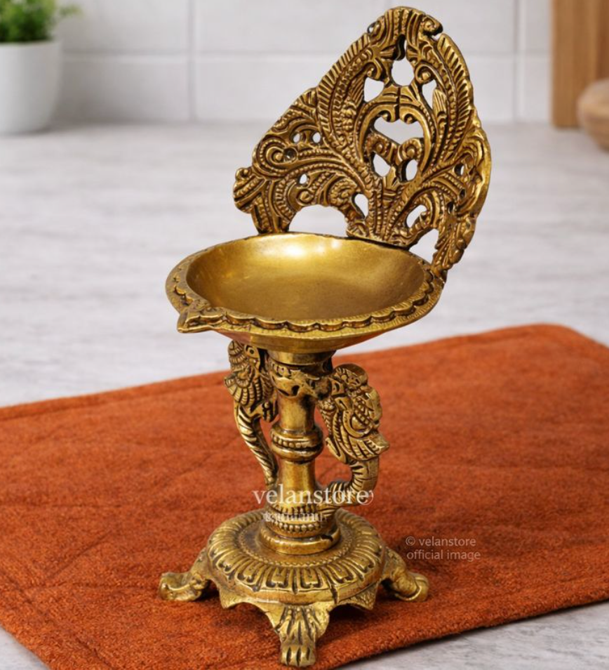 Brass engraved diya with a stand peacock and floral design 9 inch