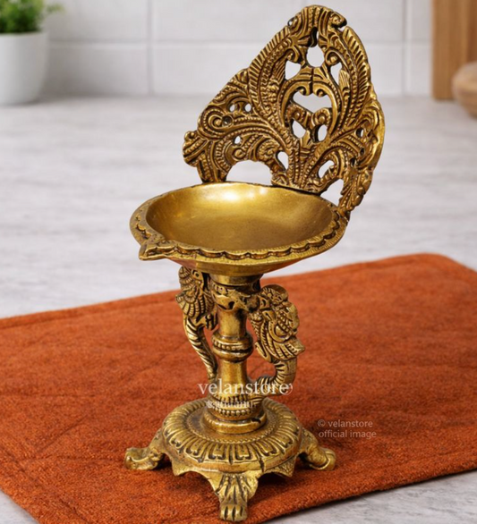 Brass engraved diya with a stand peacock and floral design 9 inch
