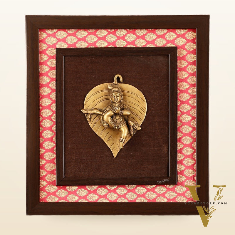 Brass Baby Krishna Baal Gopal Resting on a Leaf Hanging on Wooden Frame with Premium Fabric - 13" x 14"