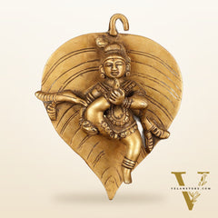 Brass Baby Krishna Baal Gopal Resting on a Leaf Hanging on Wooden Frame with Premium Fabric - 13" x 14"