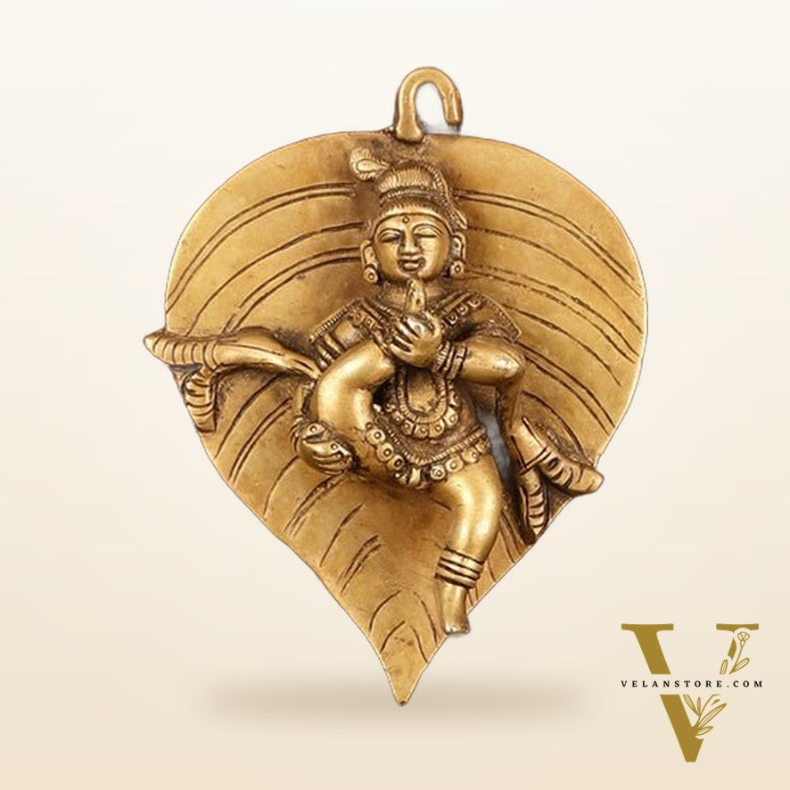 Brass Baby Krishna Baal Gopal Resting on a Leaf Hanging on Wooden Frame with Premium Fabric - 13" x 14"