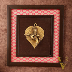 Brass Baby Krishna Baal Gopal Resting on a Leaf Hanging on Wooden Frame with Premium Fabric - 13" x 14"