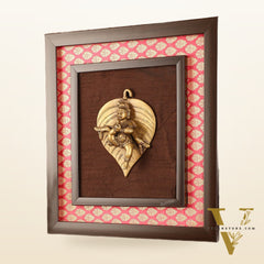 Brass Baby Krishna Baal Gopal Resting on a Leaf Hanging on Wooden Frame with Premium Fabric - 13" x 14"