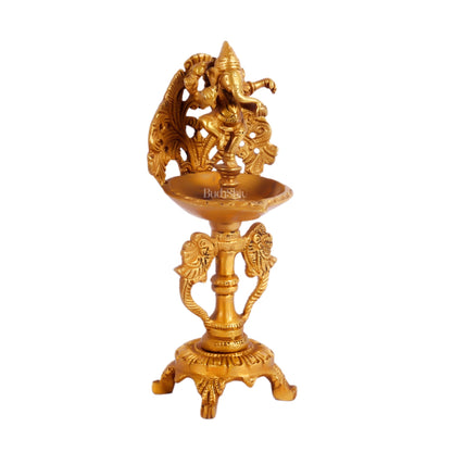 Brass engraved Dancing Ganesha diya with a stand peacock and floral design 9 inch
