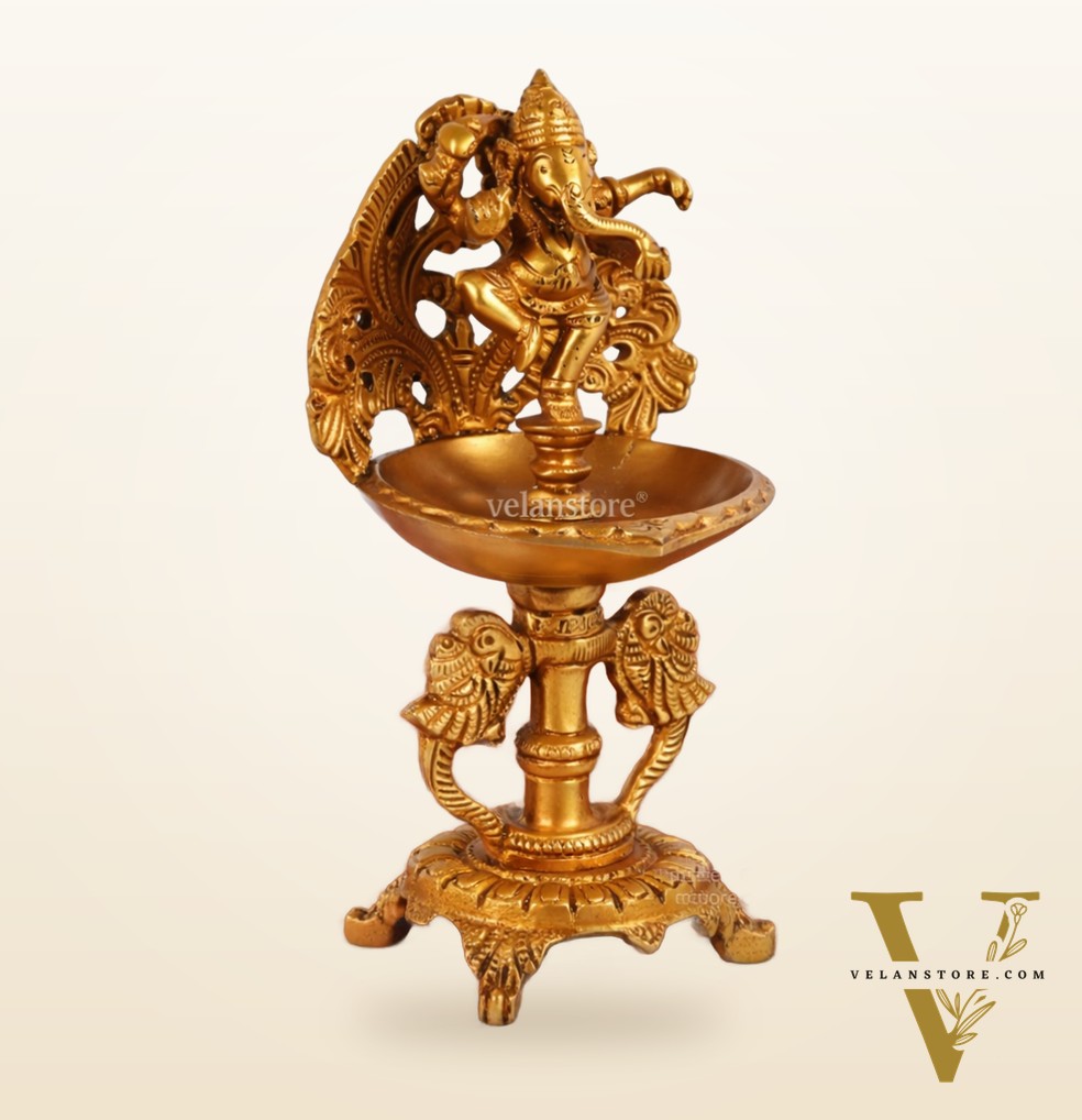 Brass engraved Dancing Ganesha diya with a stand peacock and floral design 9 inch