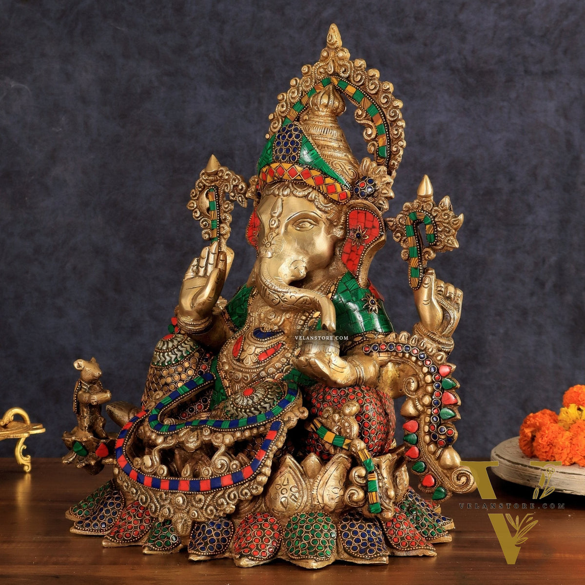 Brass Ganapati statue with sharp features - 16 inches