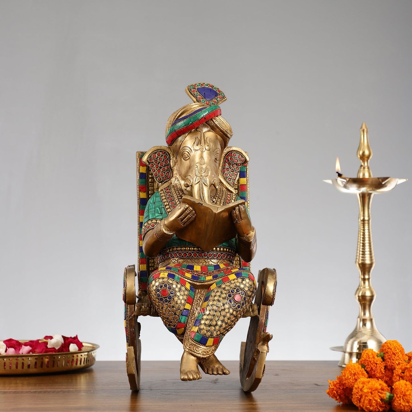 Brass Ganesha reading sitting on Chair 17"