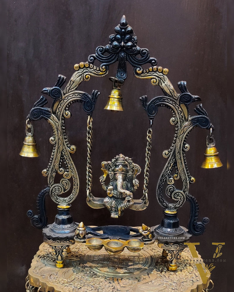 Brass Ganesha on swing with three diyas 13"