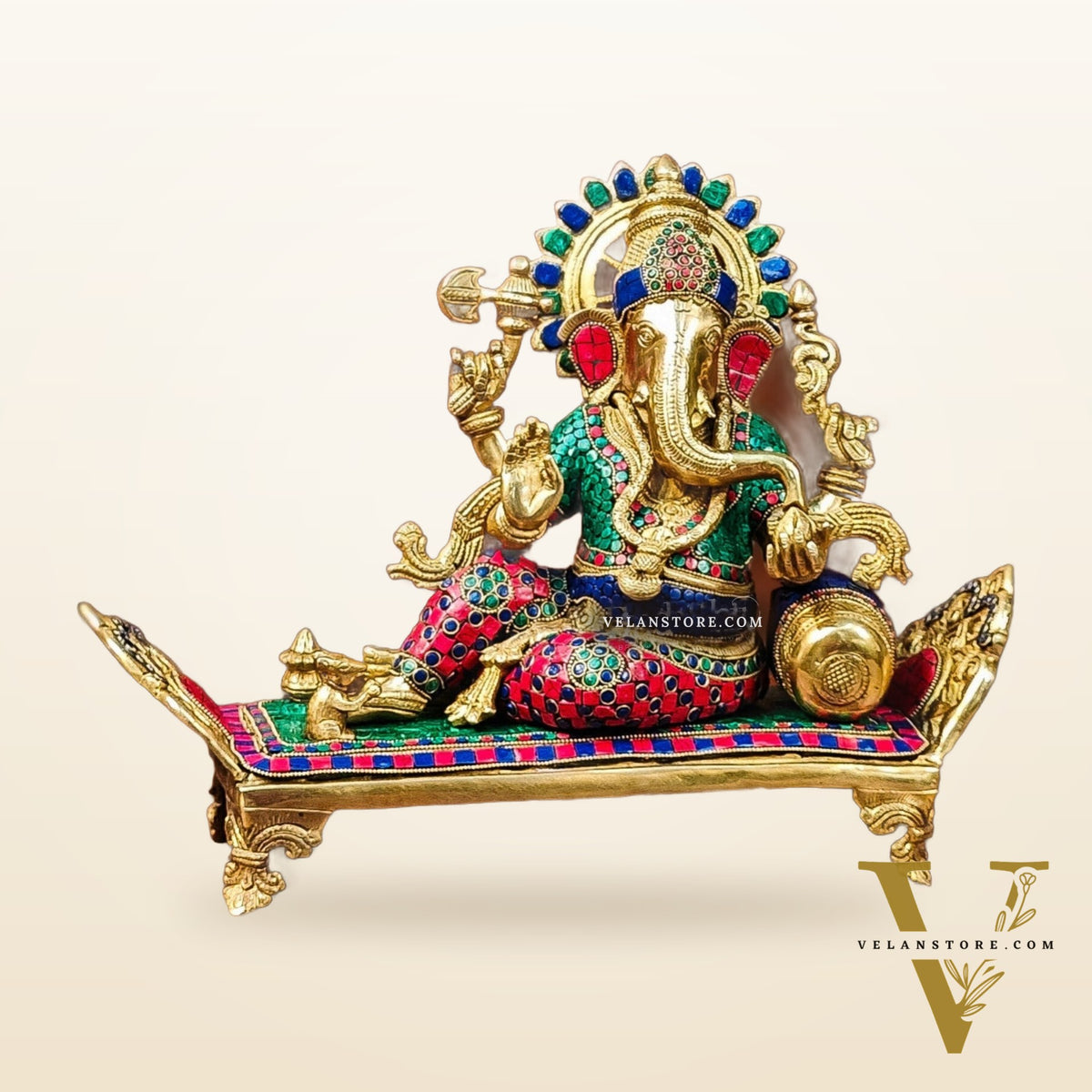 Brass Ganesha resting on diwan statue 13"