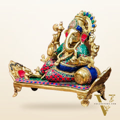 Brass Ganesha resting on diwan statue 13"