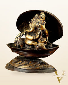 Brass Lord Ganesha Playing Veena Inside Shell – 7”