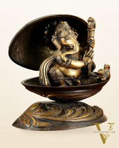 Brass Lord Ganesha Playing Veena Inside Shell – 7”
