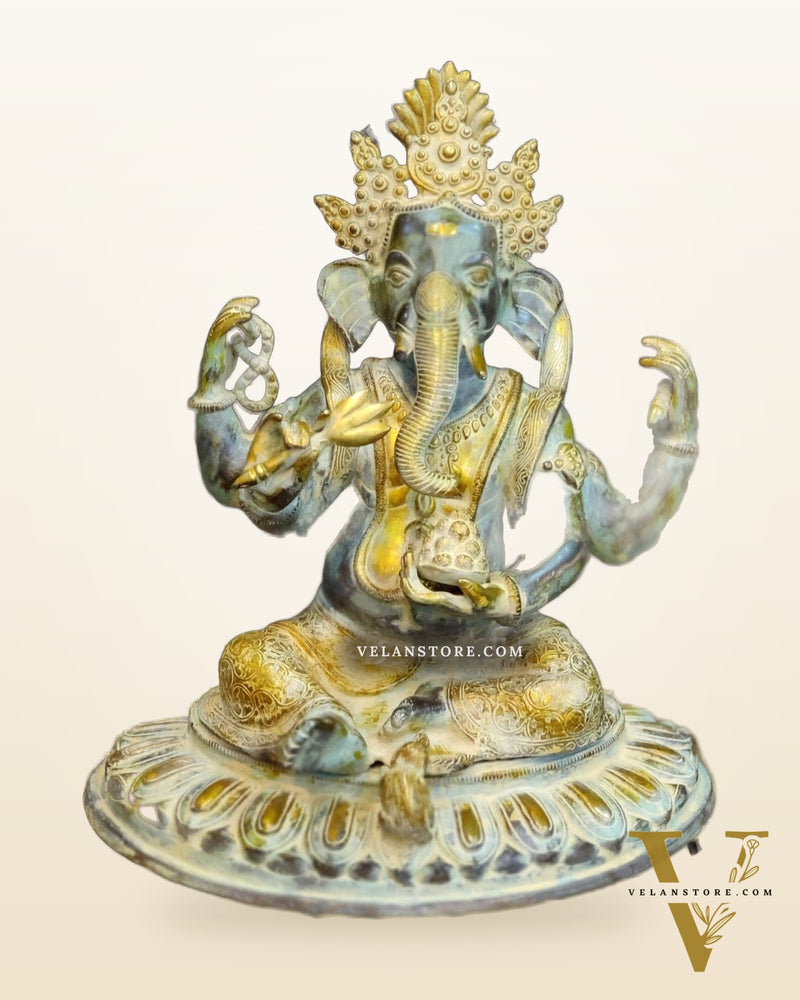 Brass Nepalese Style Ganesha seated on a round base.