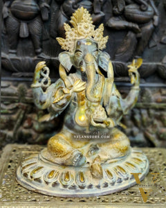 Brass Nepalese Style Ganesha seated on a round base.