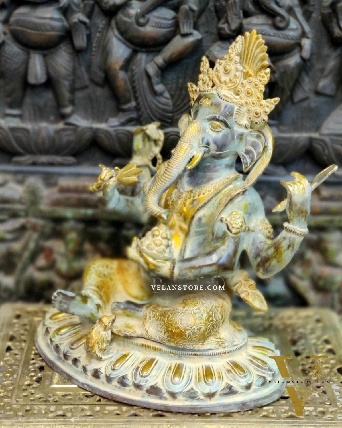Brass Nepalese Style Ganesha seated on a round base.